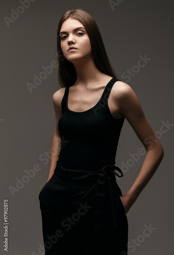 high fashion portrait of young elegant woman in black pants shoe © igor_kravtsov