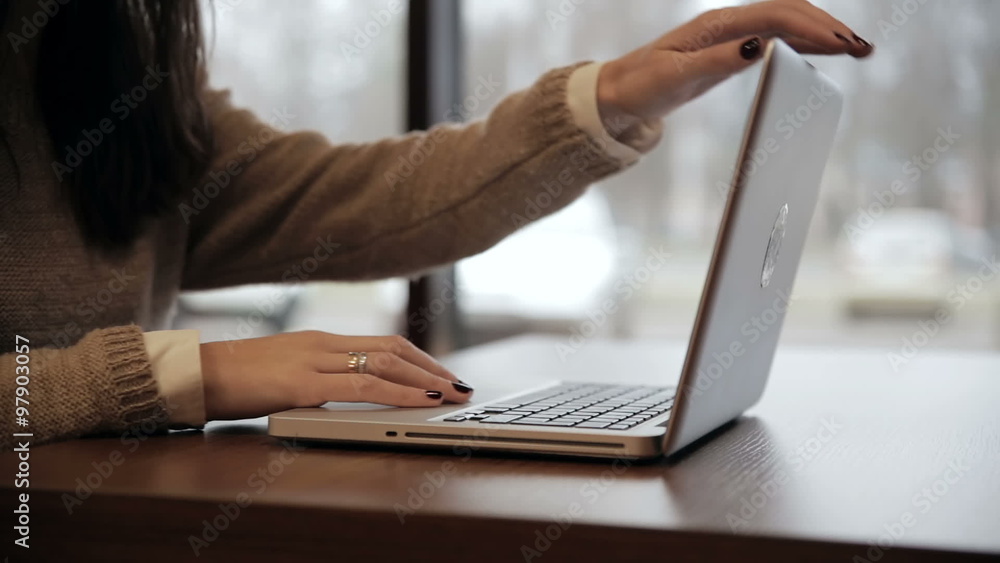 Woman closes the laptop and goes out
