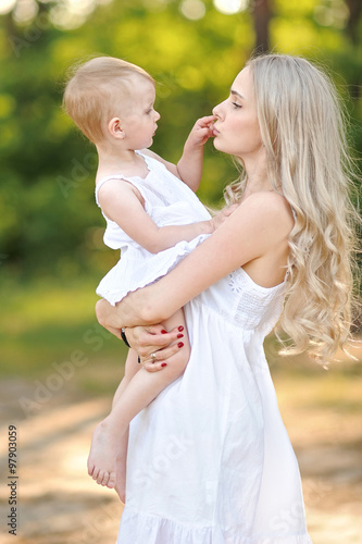 portrait of a happy family in the summer on the nature