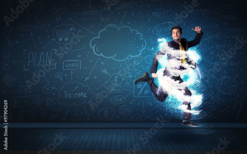 Fototapeta Naklejka Na Ścianę i Meble -  Happy business man jumping with storm cloud around him