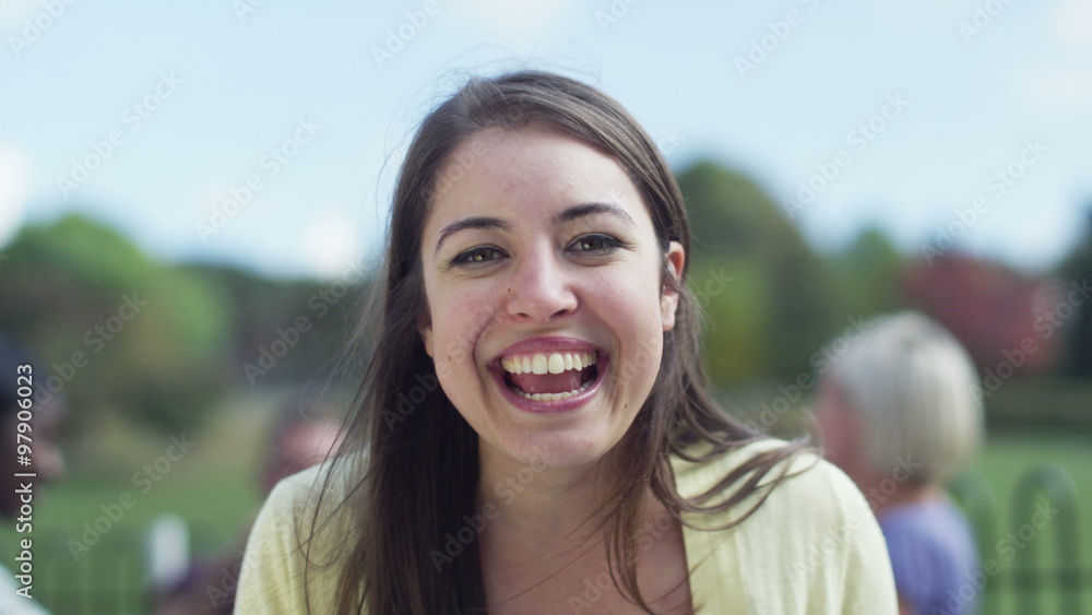 Happy young woman having a video chat, as seen from the computer screen's pov Happy young woman having a video chat, as seen from the computer screen's pov
