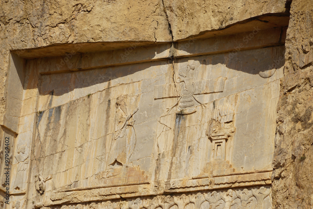 Stone carvings in bas-relief on the Tomb of Xerxes I at Persepol