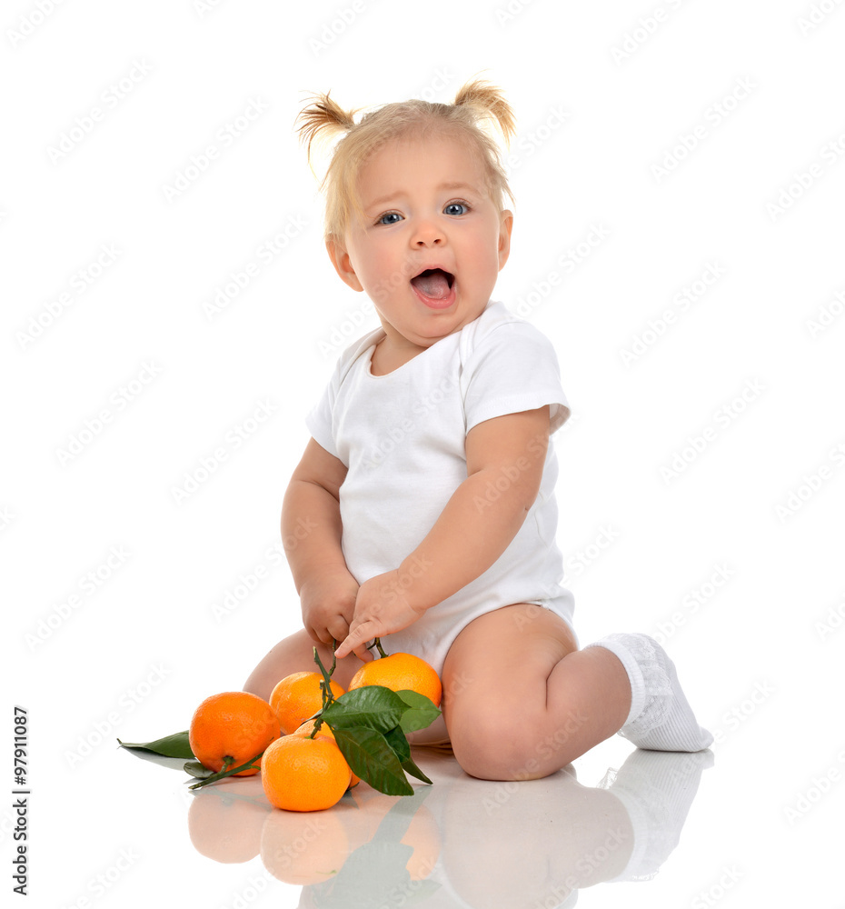 baby girl happy sitting smilling screaming with fresh orange man baby girl happy sitting smilling screaming with fresh orange man