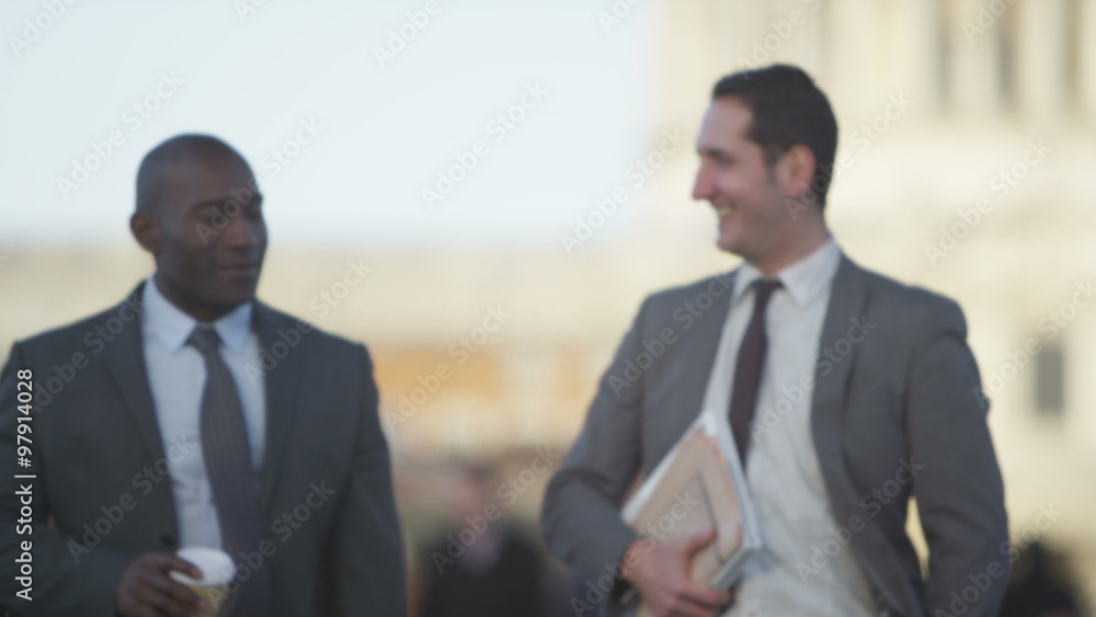 Smart London Businessmen chatting as they walk through the city. Shot on RED Epic. Smart London Businessmen chatting as they walk through the city. Shot on RED Epic.