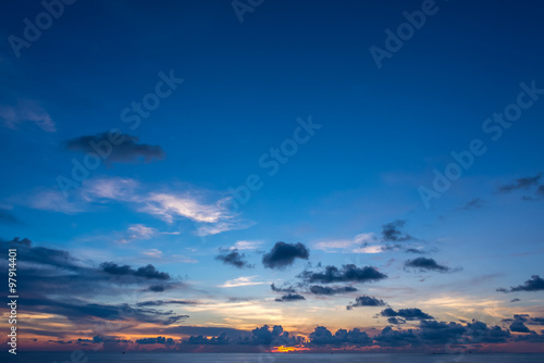 view of sunset into the ocean with twilight sky