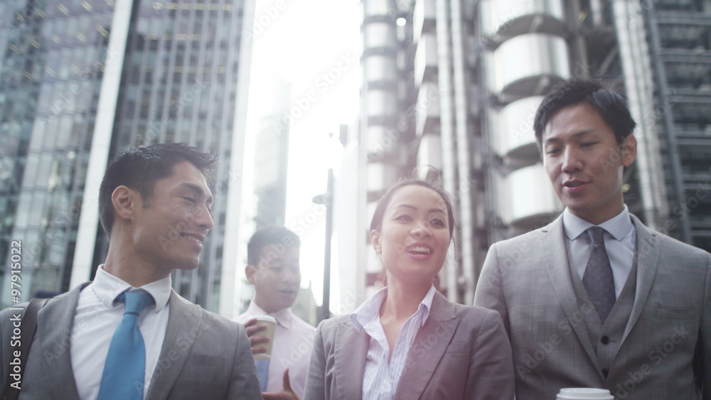 Portrait of cheerful Asian businesswomen chatting outdoors in the city Portrait of cheerful Asian businesswomen chatting outdoors in the city