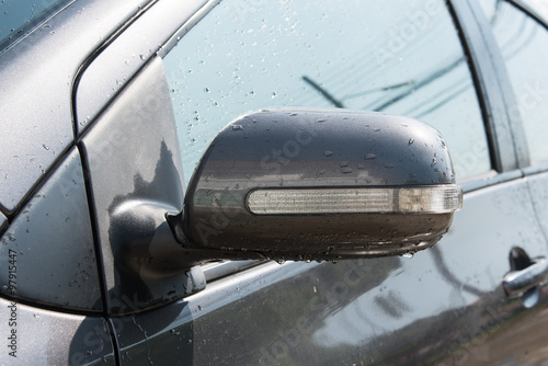 Wing mirror of grey car