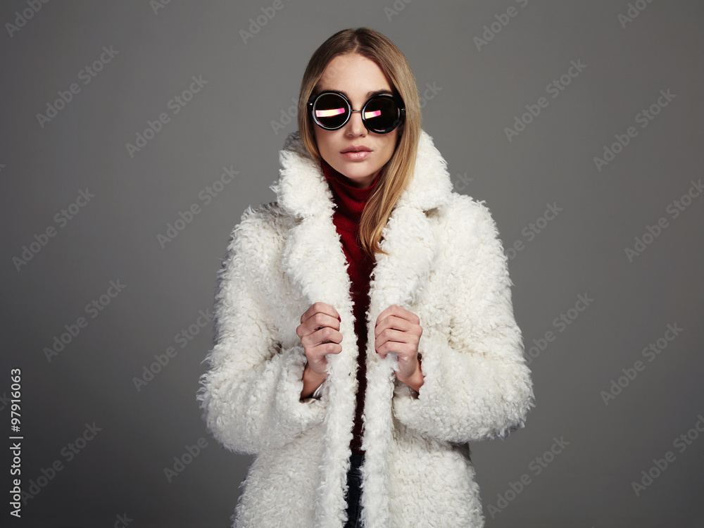 beautiful winter girl in white fur and sunglasses. winter fashion beautiful winter girl in white fur and sunglasses. winter fashion