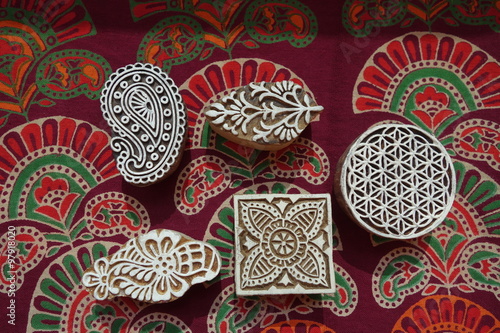Indian wood printing block with block printed textile background