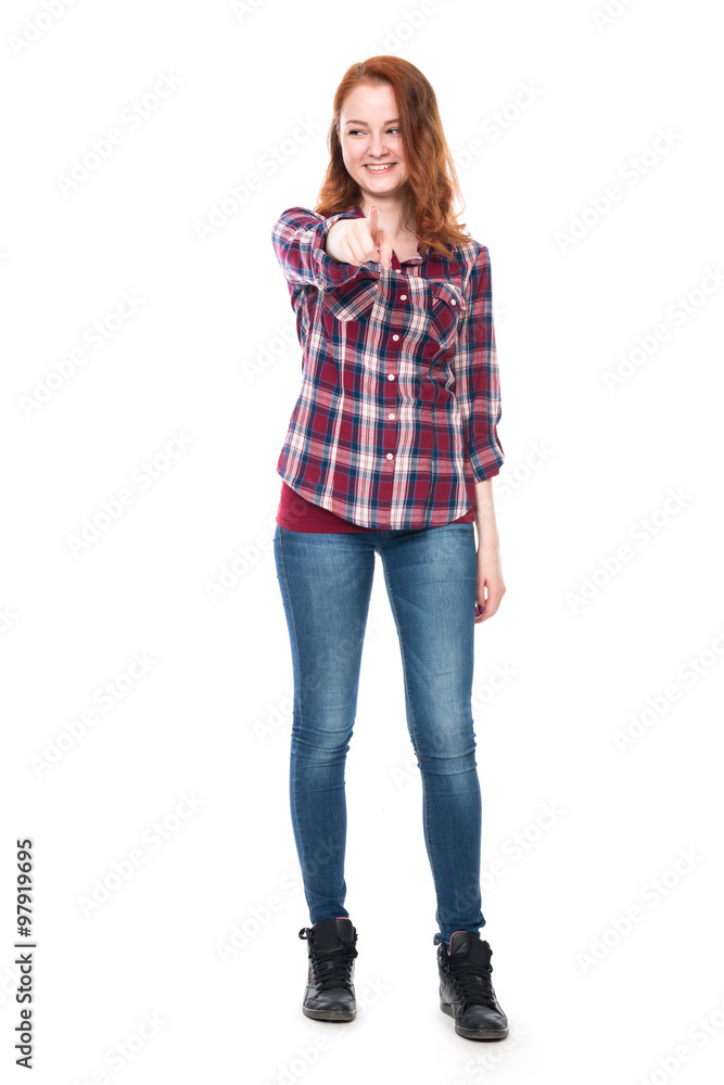 A girl standing in full body smiling showing his finger at the c A girl standing in full body smiling showing his finger at the c