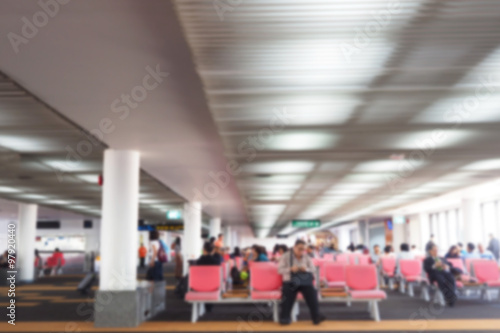 Wallpaper Mural Defocus blurred picture of travellers, passengers waiting for their flight at airport Torontodigital.ca
