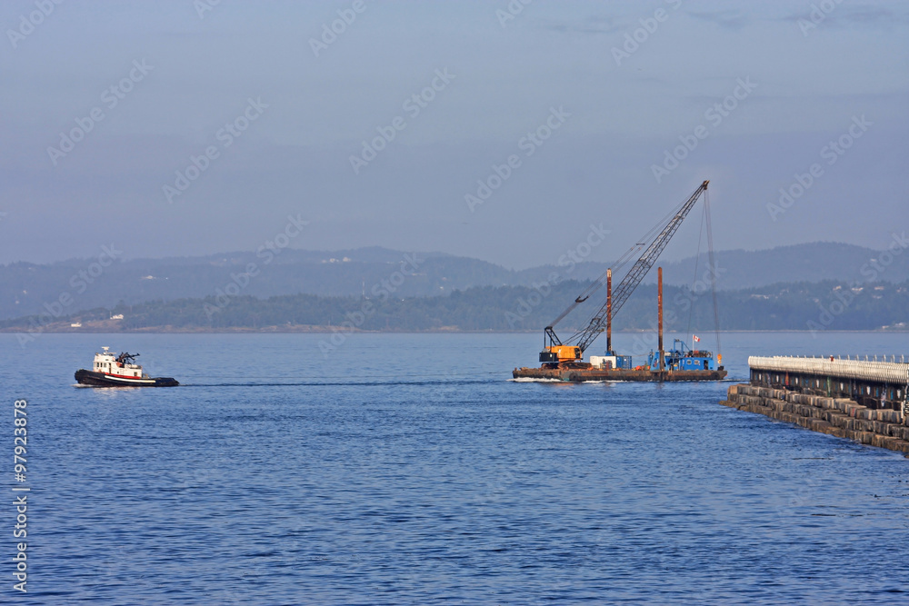 Tug pulling Crane Tug pulling Crane