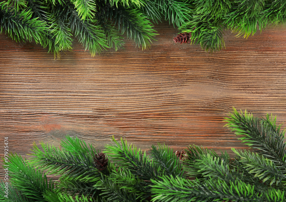 Christmas fir tree branches on wooden table Christmas fir tree branches on wooden table