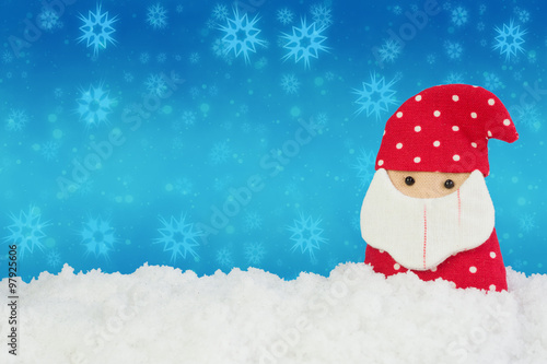 Fabric  Santa doll on white snow with abstract background