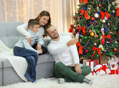 Happy family making photo i...