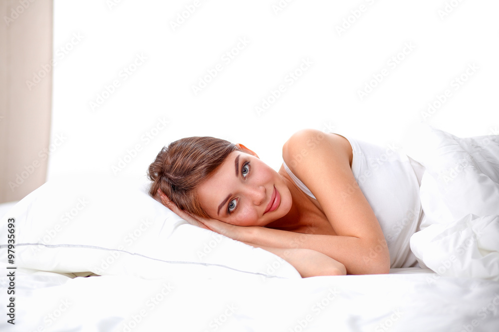 Beautiful girl sleeps in the bedroom, lying on bed Beautiful girl sleeps in the bedroom, lying on bed