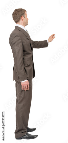 Businessman with raised arm on white