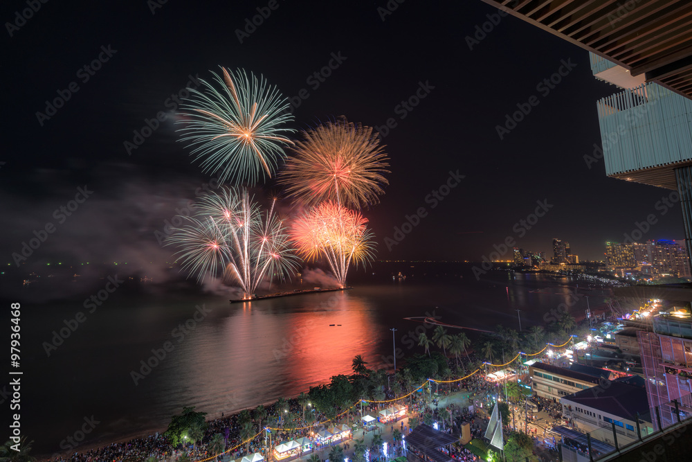 Group of people enjoying spectacular fireworks show in a carnival or holiday. Group of people enjoying spectacular fireworks show in a carnival or holiday.