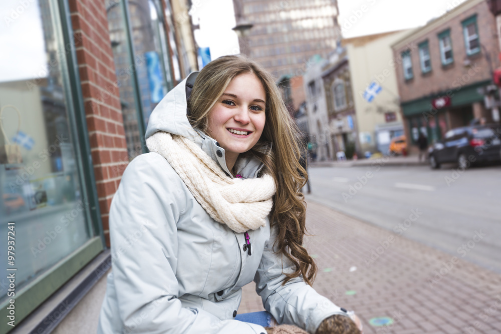Portrait of a teen girl with long hair in an urban environment Portrait of a teen girl with long hair in an urban environment