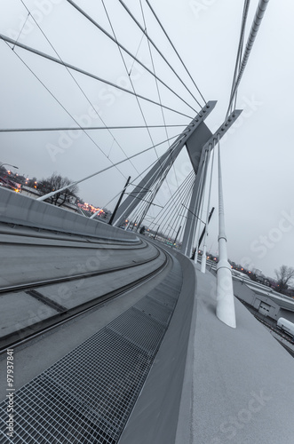 Tram lights trails on tram cable-stayed bridge in Krakow, Poland © tomeyk