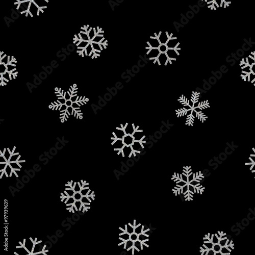 Seamless pattern of falling silver snowflakes.