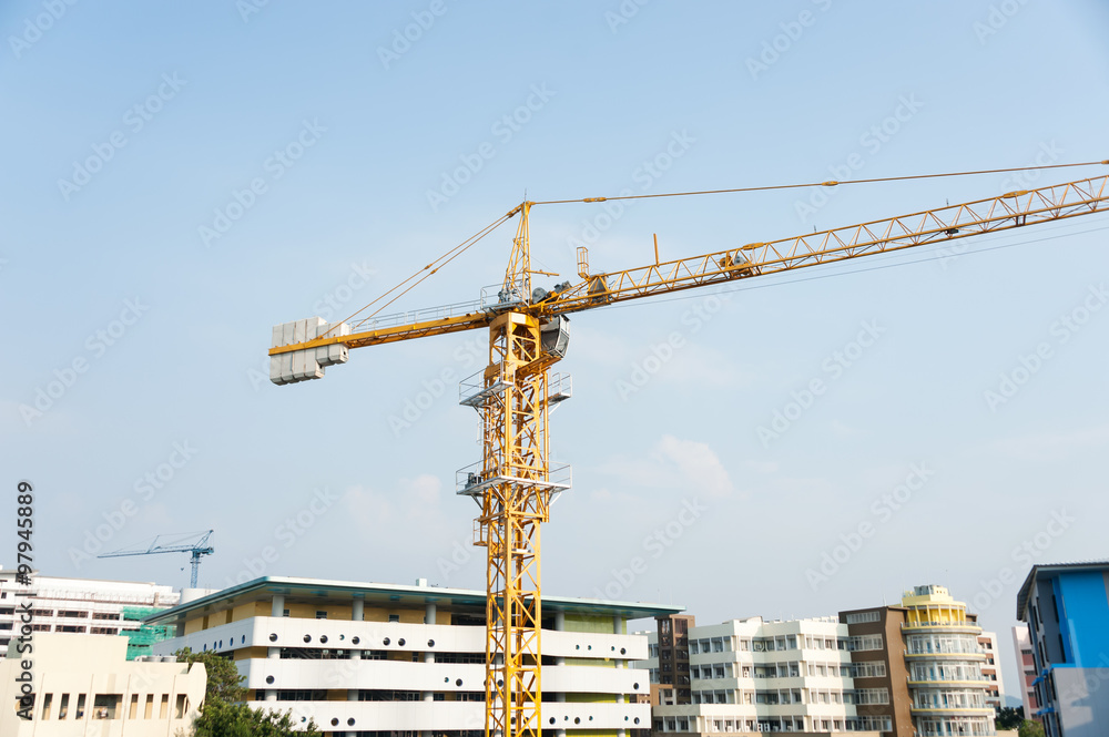 Crane in construction with blue sky Crane in construction with blue sky