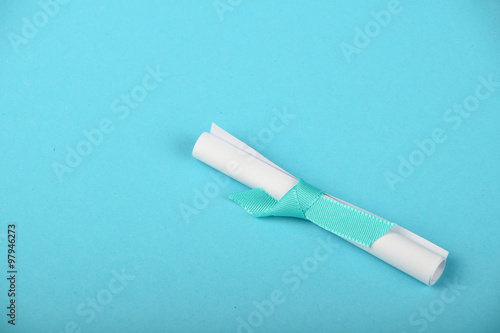 One white paper scroll message on blue background