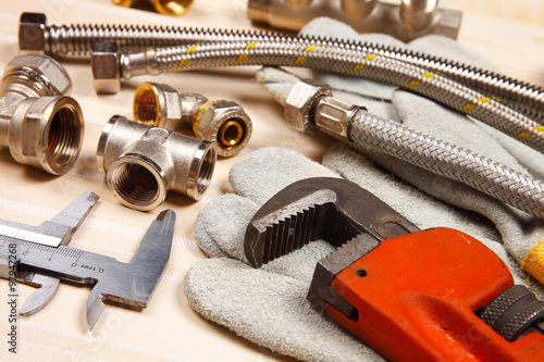 Set of plumbing and tools on the table