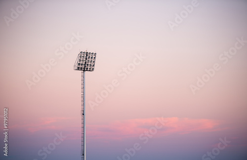 sportlights tower with background twilight photo