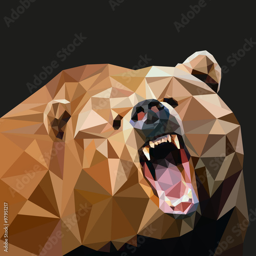 Brown bear in the style of triangulation on a black background. Vector illustration
