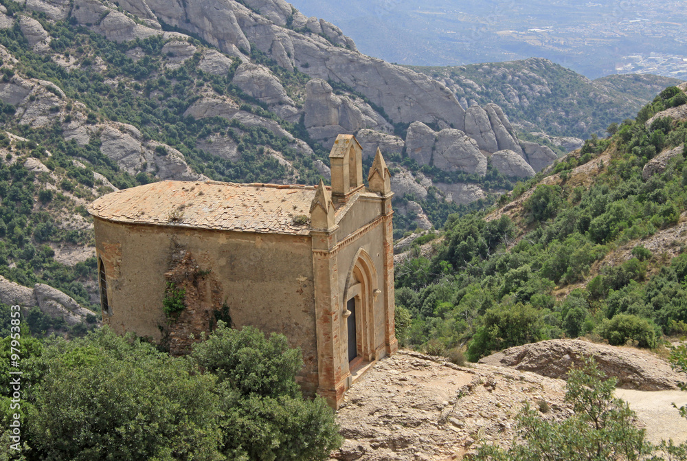MONTSERRAT, SPAIN - AUGUST 28, 2012: Saint Joan hermitage in Montserrat Mountain, Spain. Benedictine abbey Santa Maria de Montserrat in Monistrol de Montserrat