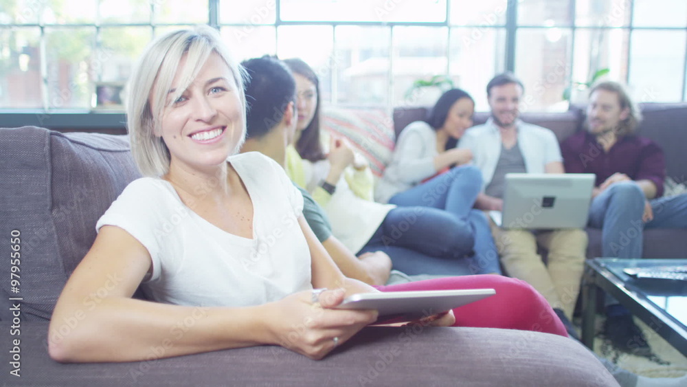 Attractive people socialise together whilst using technology. Portrait Attractive people socialise together whilst using technology. Portrait