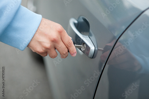 Woman Hand Holding Key Car to Unlock,