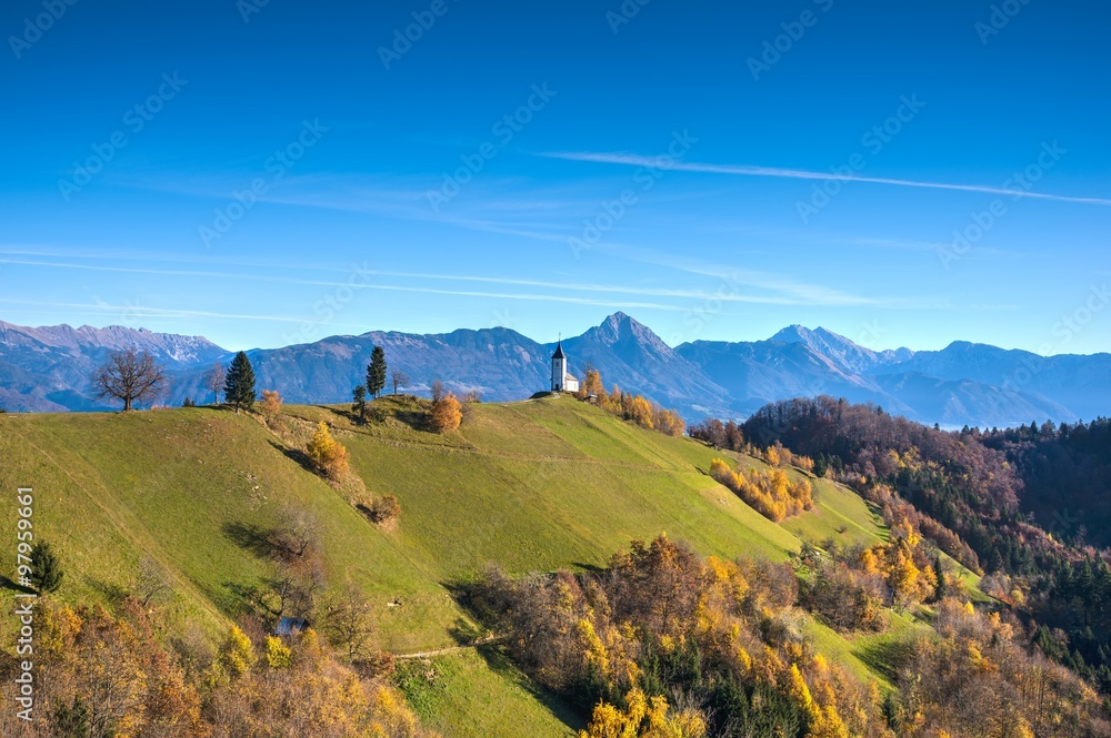 Fototapeta premium Church in the mountains in Autumn