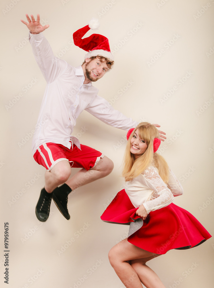Obraz premium Happy active couple dancing and jumping.
