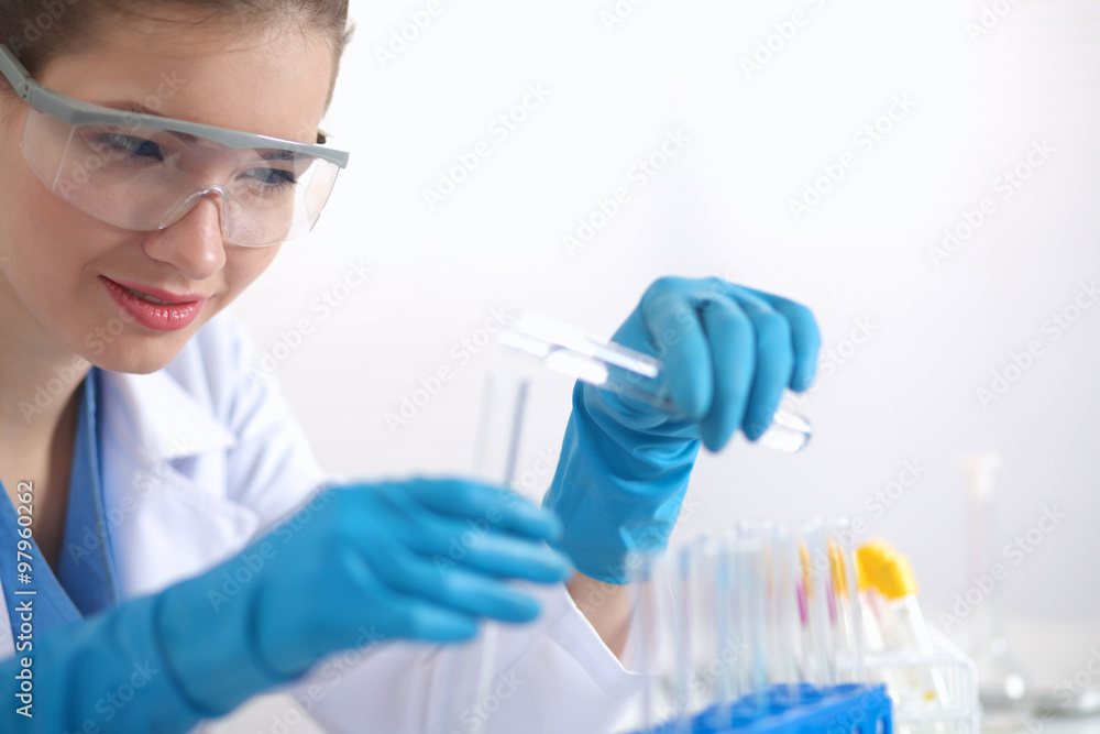 Woman researcher is surrounded by medical vials and flasks, isolated on white background Woman researcher is surrounded by medical vials and flasks, isolated on white background