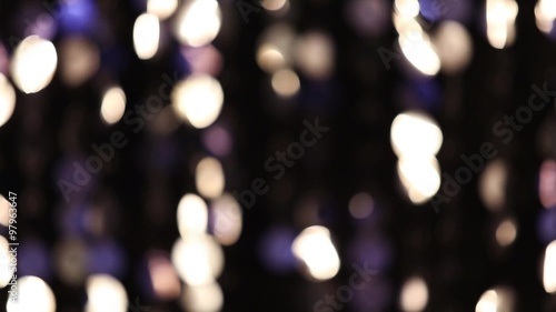 Abstract glittering lights, silver background, a real shot video in the blur