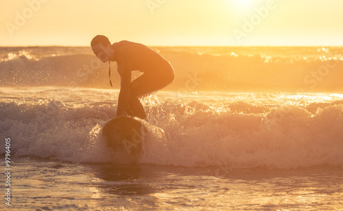 Surfer performing tricks on the waves