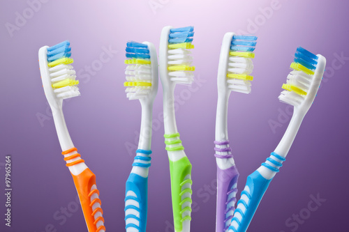 a group of colorful toothbrushes