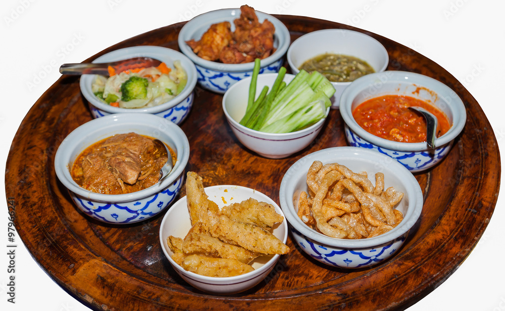 Chinese or Thai food on a rotating tablet-isolated