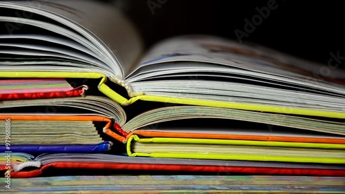 A pile of childrens books with a pencil and apple on top. Teachers pet. books stacked with formulas fund, education. 