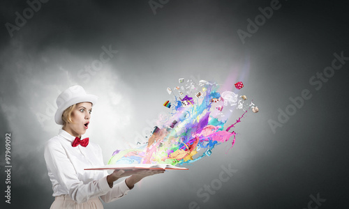 Astonished woman looking in book