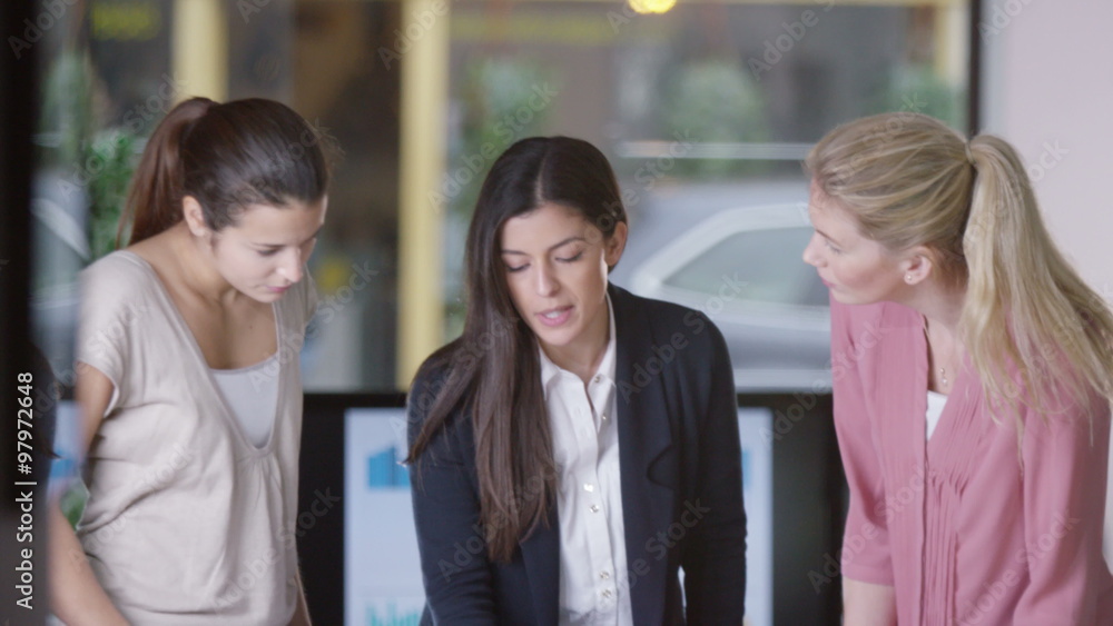 Female casual creative business team brainstorming for ideas in a meeting Female casual creative business team brainstorming for ideas in a meeting