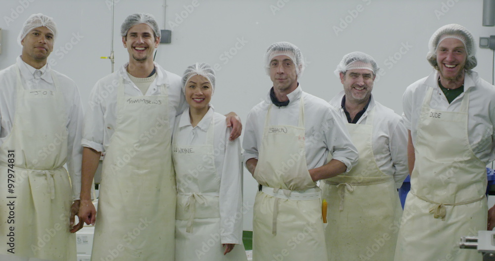 Portrait of cheerful worker in a seafood processing factory
