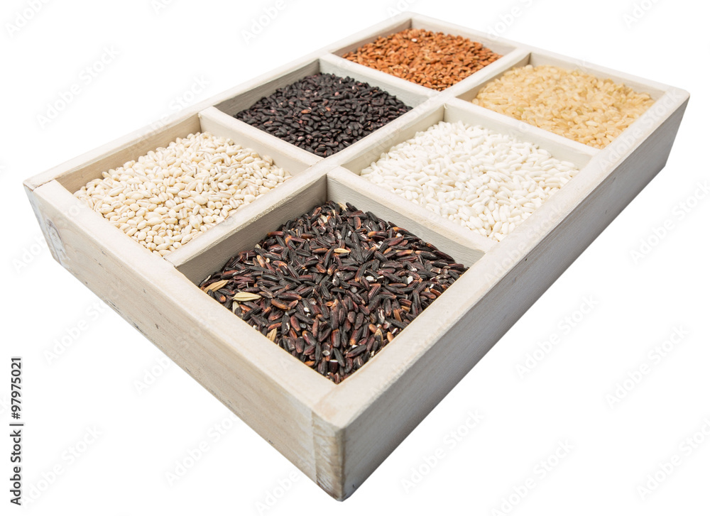 Rice and millet grains assortment in white box over white background Rice and millet grains assortment in white box over white background