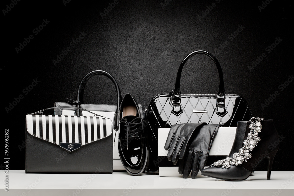 beautiful set of women's fashion accessories on black background - obrazy, fototapety, plakaty 