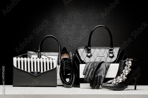 beautiful set of women's fashion accessories on black background