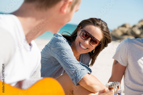 Beautiful young people with guitar on beach © Sergey Nivens