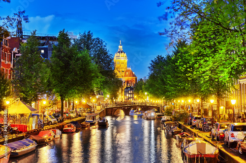 Photography Westerkerk (Western Church), with water canal view in Amsterdam.