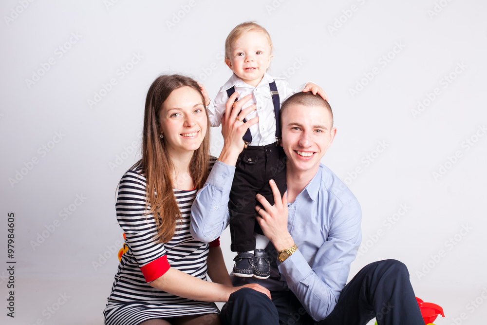 Smiling parents with child